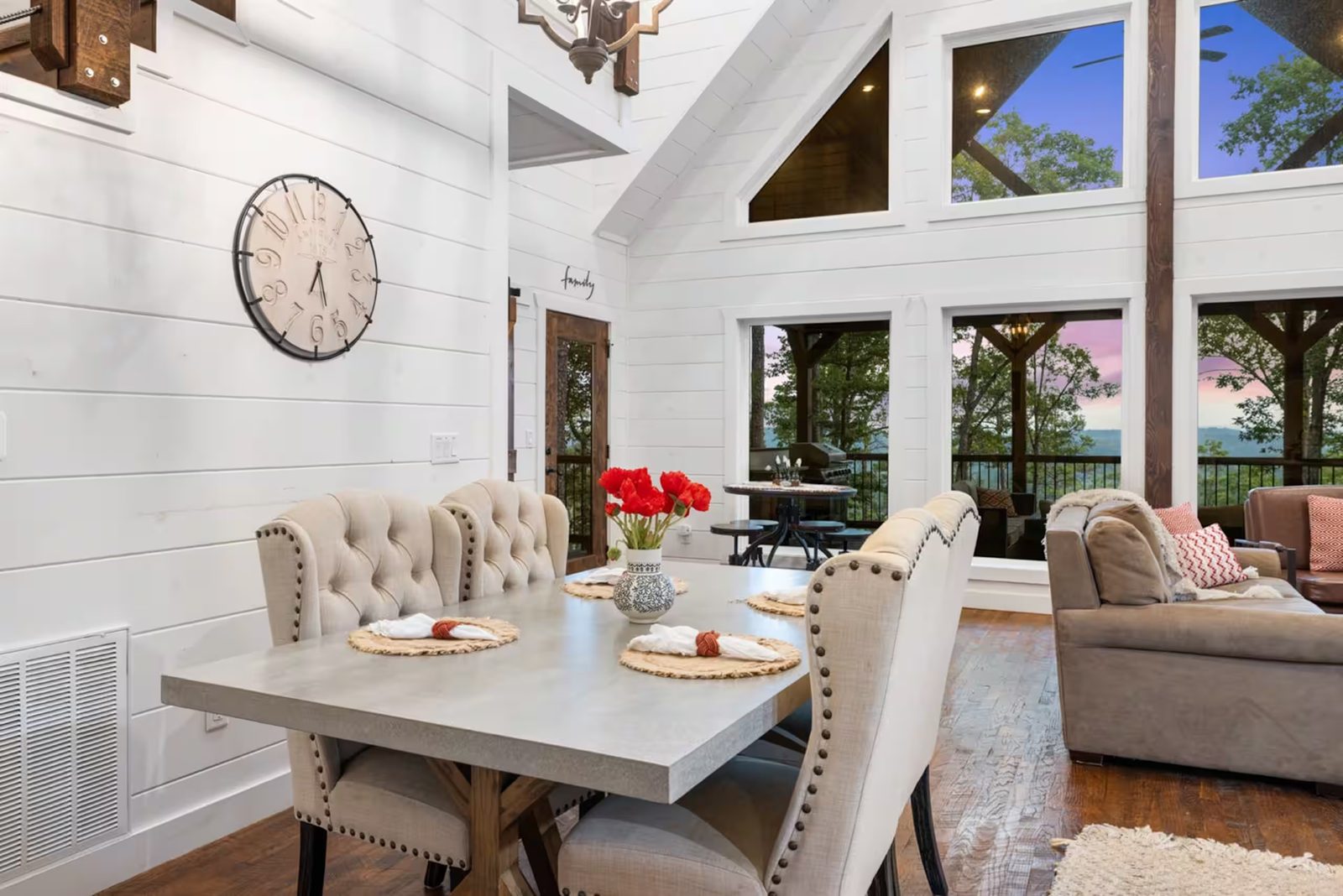 Dining table set beside the windows.